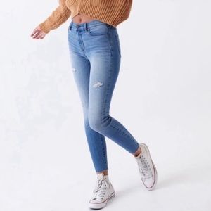 Blue skinny jeans with rips